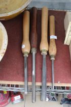 FOUR LARGE WOODEN HANDLED LATHE TOOLS AND CHISELS