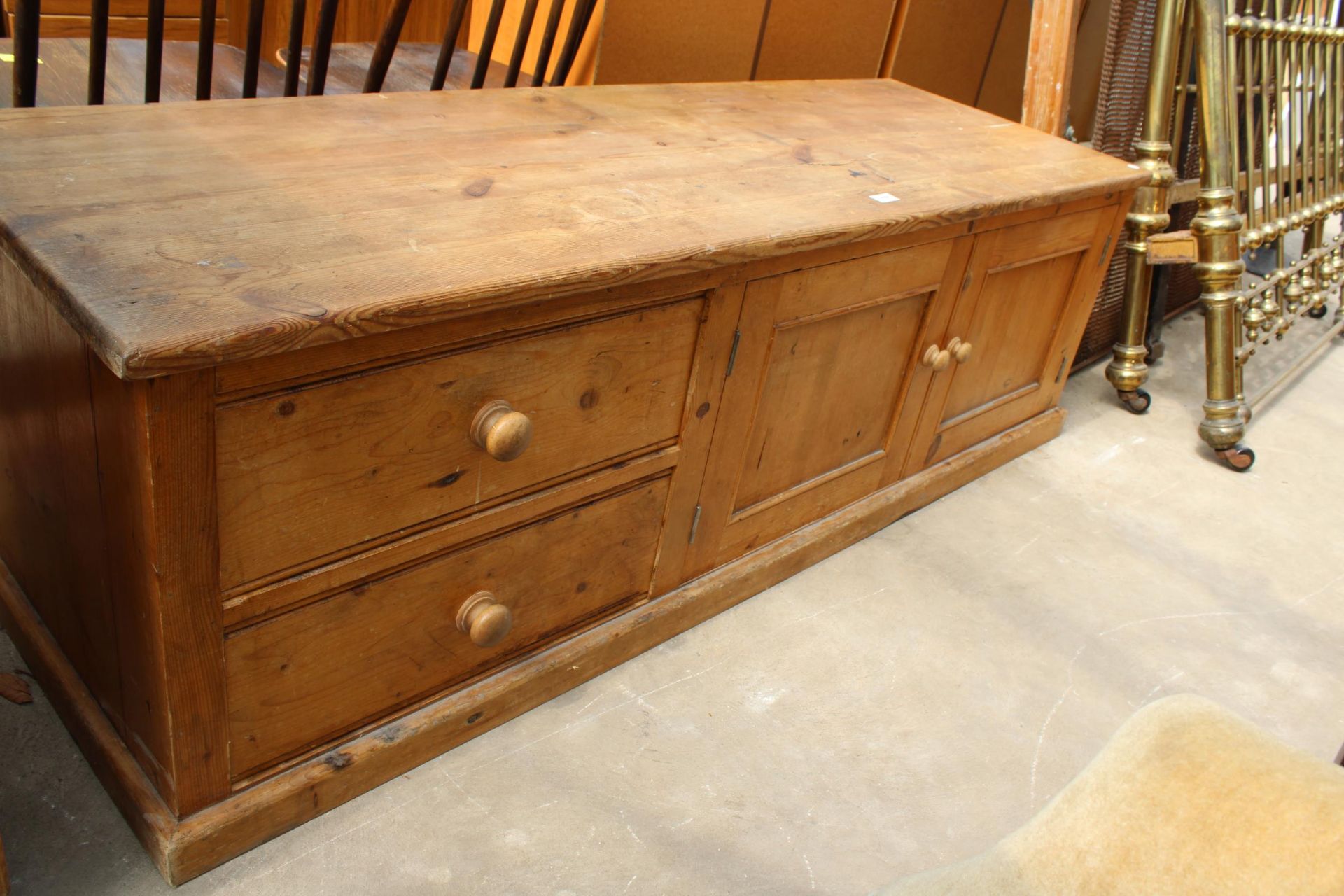 A MODERN PINE LOW CUPBOARD ENCLOSING TWO DRAWERS AND CUPBOARDS, 66" WIDE - Image 3 of 4