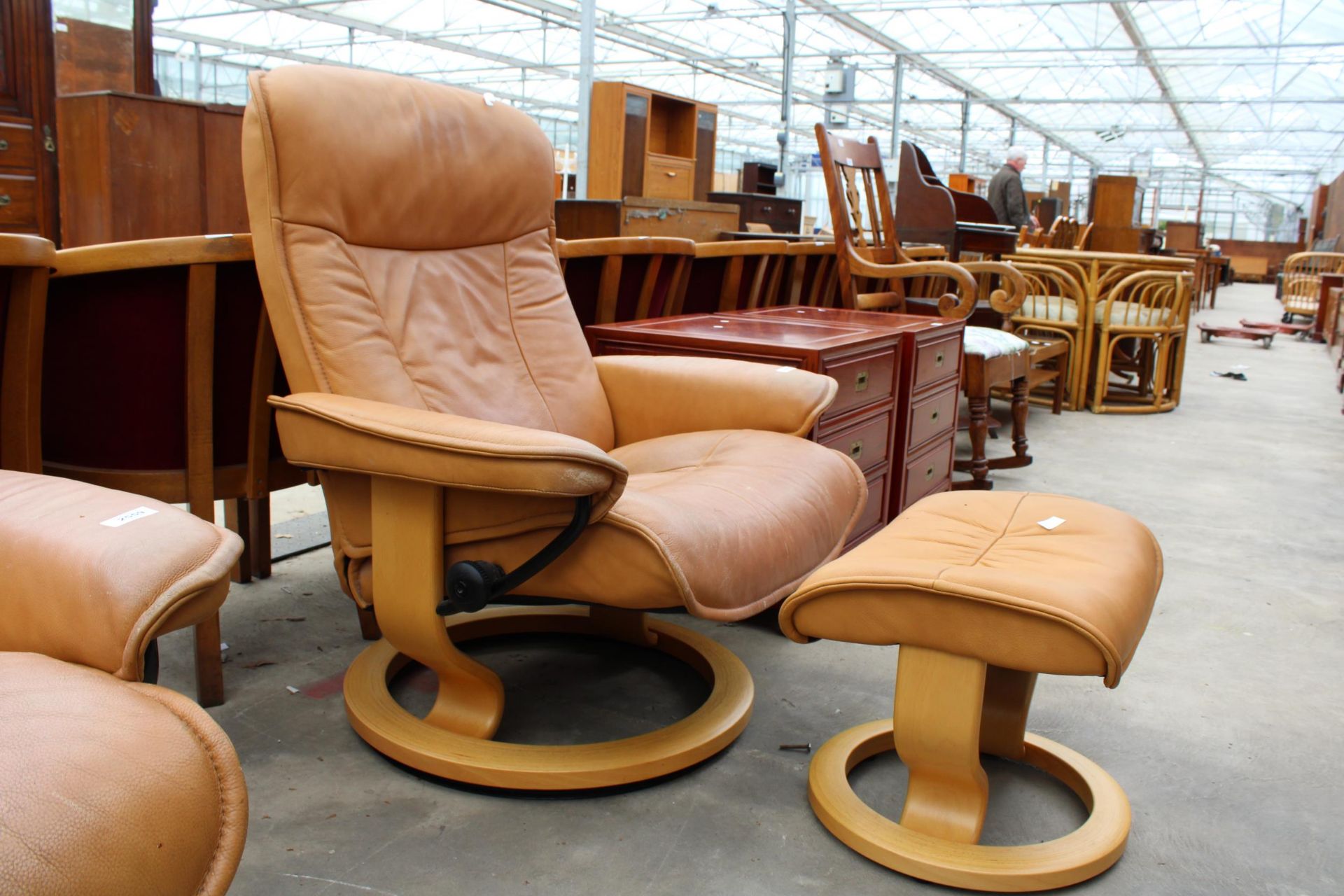 A STRESSLESS EKORNES TANNED LEATHER SWIVEL RECLINER WITH STOOL - Image 2 of 3