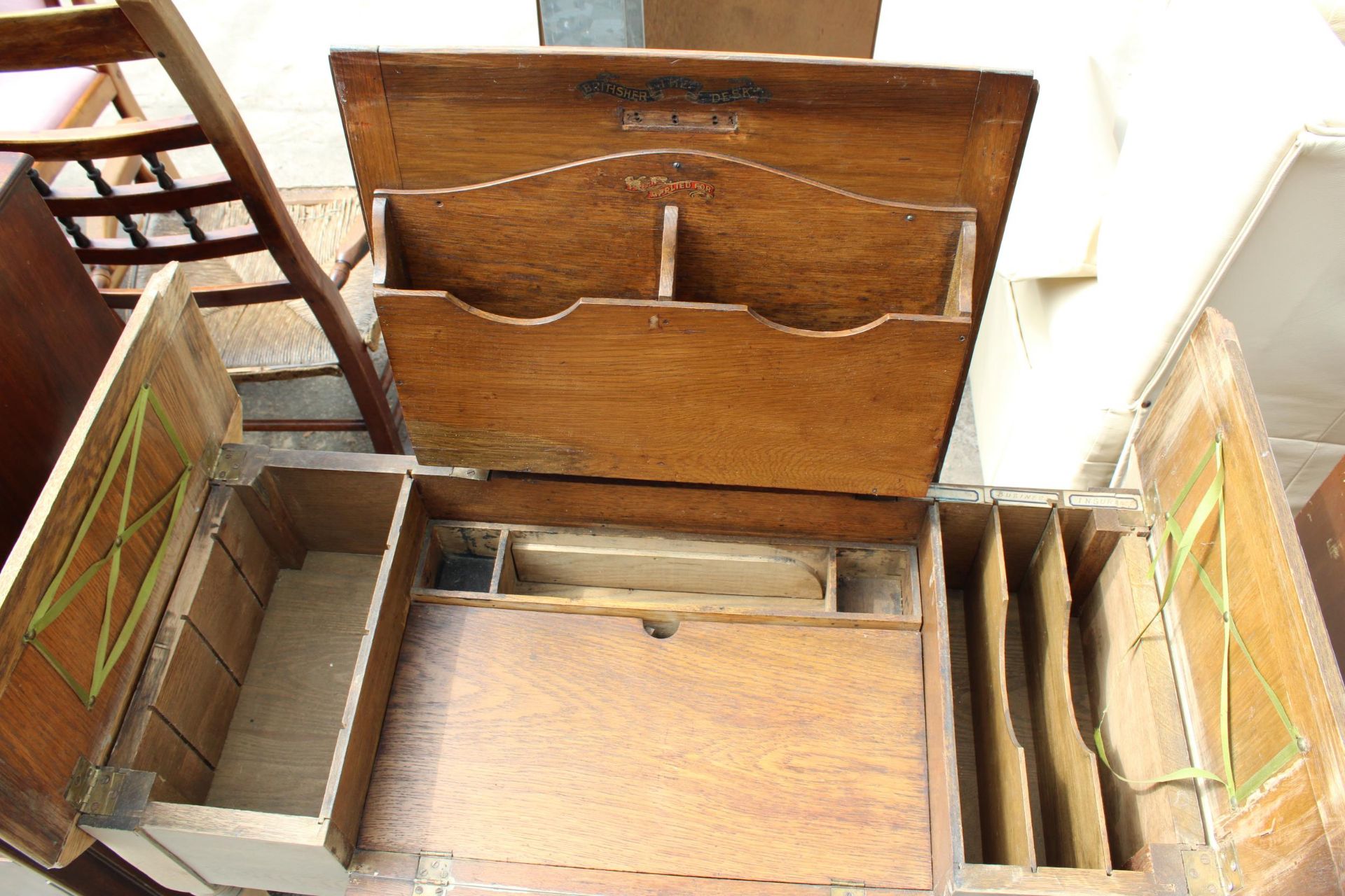 AN EARLY 20TH CENTURY OAK 'THE BRITISHER DESK' WITH FOLD-OUT WRITING AND STORAGE SECTIONS, 36" WIDE - Image 3 of 6