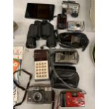 A MIXED LOT TO INCLUDE CAMERAS, PHONES, PSP, A PAIR OF BINOCULARS PLUS A AMAZON TABLET ETC