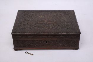 AN ANGLO INDIAN HEAVILY CARVED BOX WITH KEY