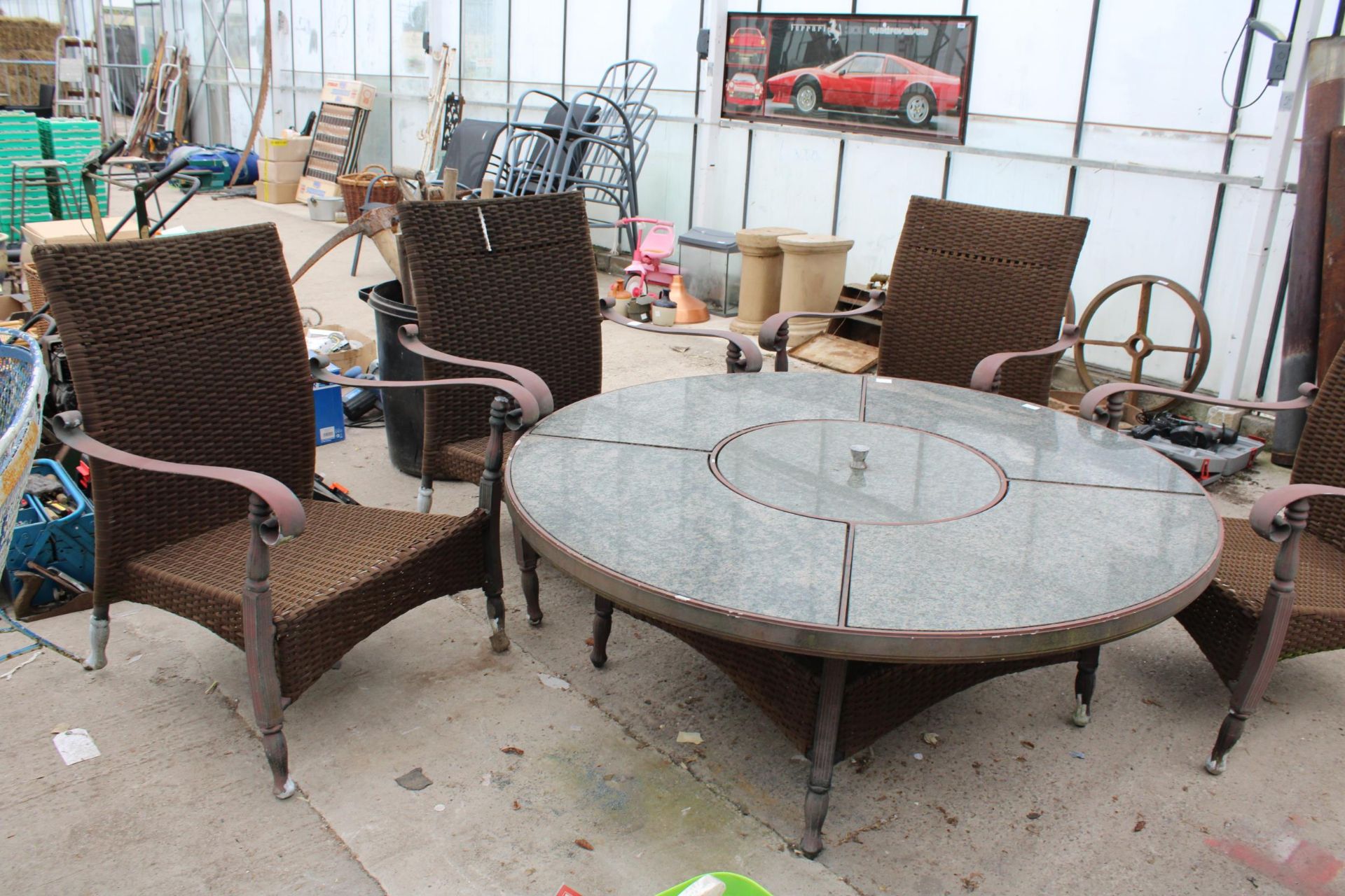A GARDEN FURNITURE SET COMPRISING OF FOUR RATTAN CHAIRS AND A GRANITE TOP TABLE WITH FIRE PIT CENTRE - Image 2 of 4