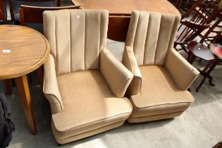 A PAIR OF MODERN LOW UPHOLSTERED LOUNGE CHAIRS