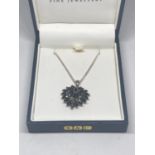 A MARKED SILVER NECKLACE WITH A BLACKSTONE PENDANT IN A PRESENTATION BOX