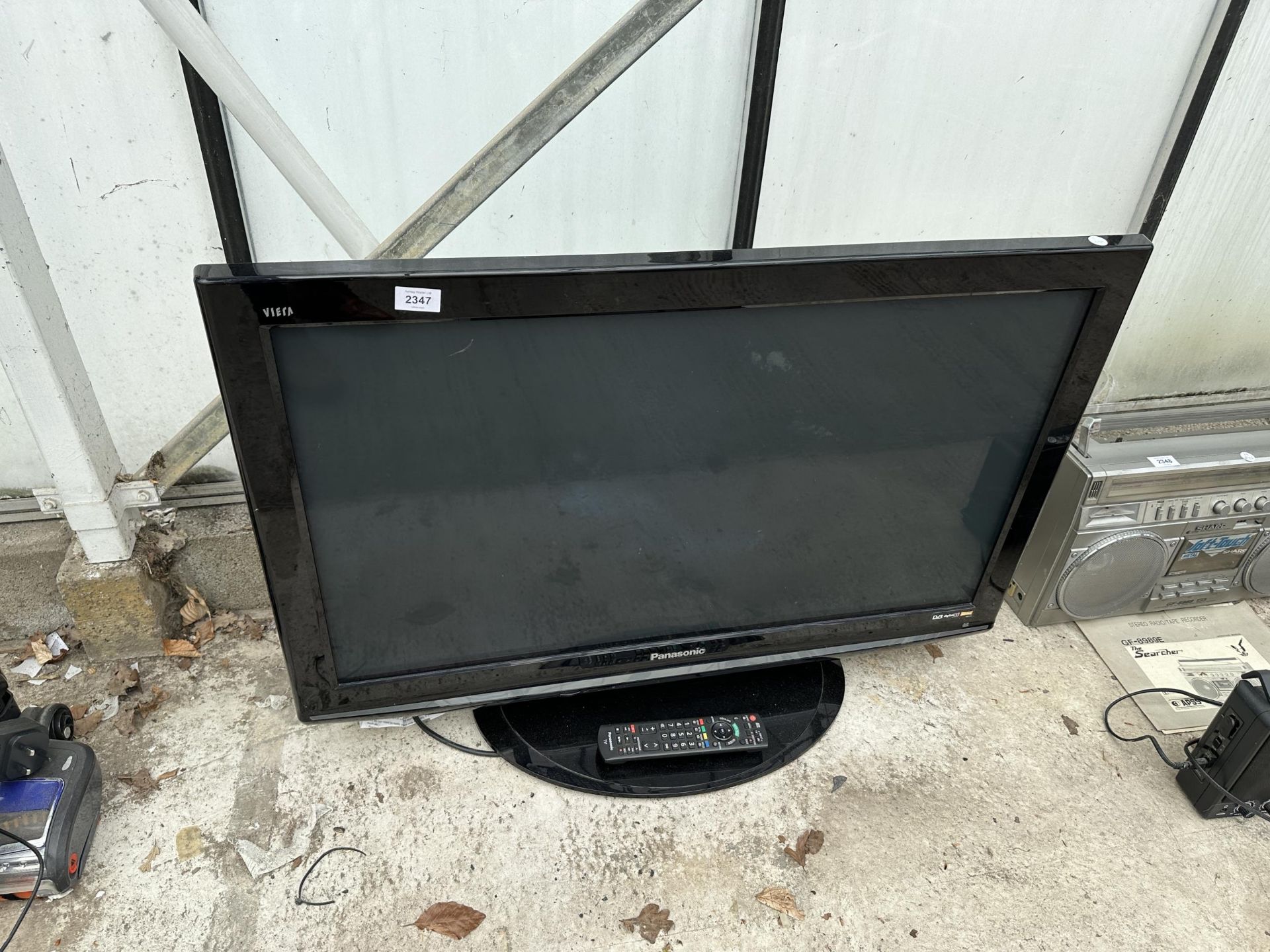 A PANASONIC 37" TELEVISION WITH REMOTE CONTROL