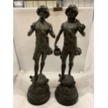 A LARGE PAIR OF SPELTER FIGURES OF BOYS - APPROXIMATELY 54CM HIGH