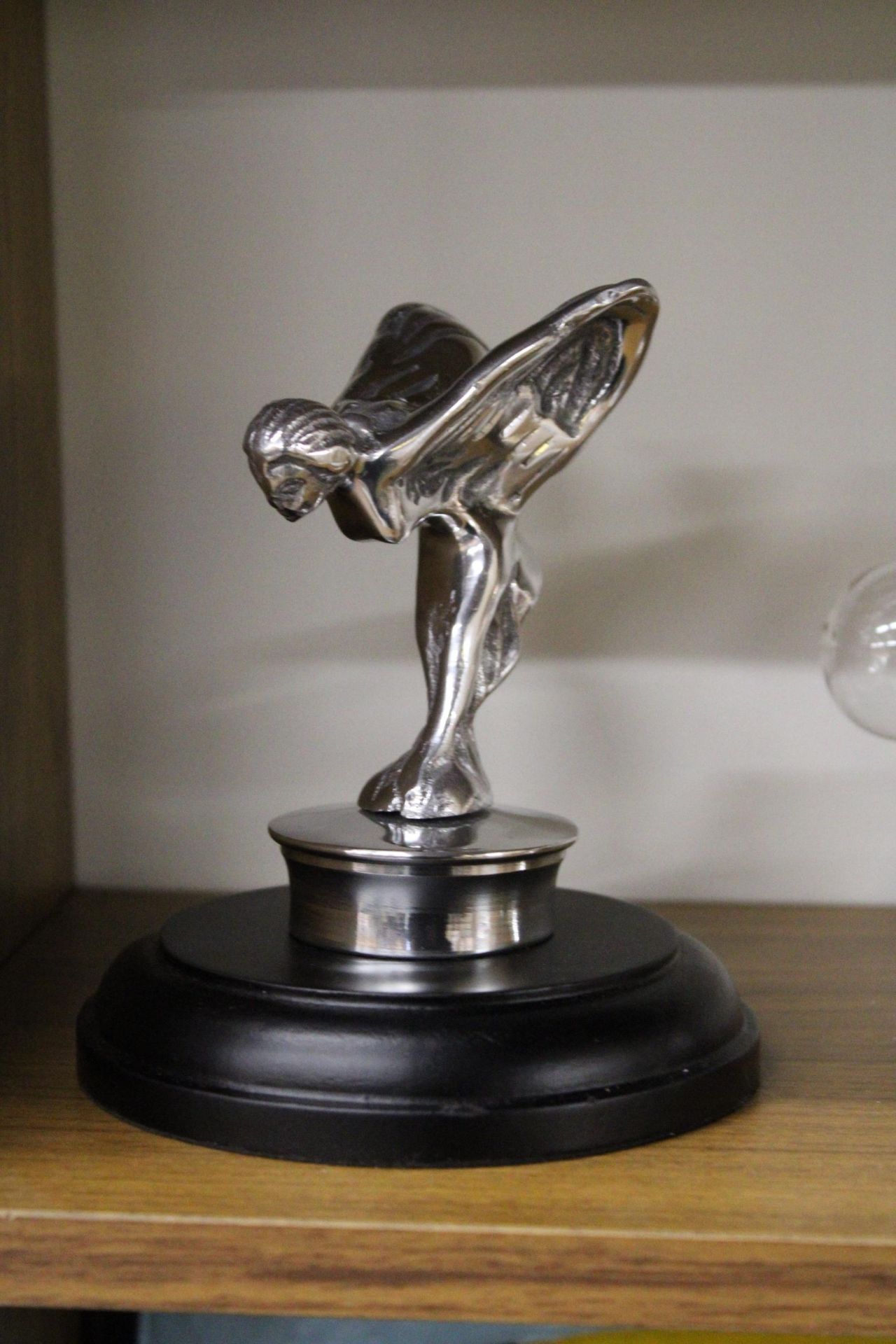 A CHROME FLYING LADY ON A BASE, HEIGHT 14.5CM