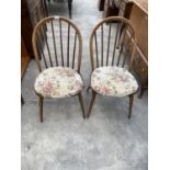 A PAIR OF ERCOL ELM AND BEECH WINDSOR STYLE DINING CHAIRS