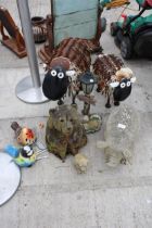 AN ASSORTMENT OF GARDEN FIGURES TO INCLUDE TWO METAL SHEEP, A CARVED BEAR AND A FIBRE GLASS PIG ETC