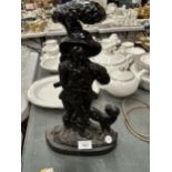 A CAST IRON DOOR STOP - APPROXIMATELY 38CM HIGH