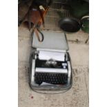 A REMINGTON PERFORMER TYPEWRITER WITH CARRY CASE