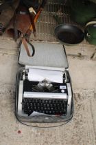 A REMINGTON PERFORMER TYPEWRITER WITH CARRY CASE