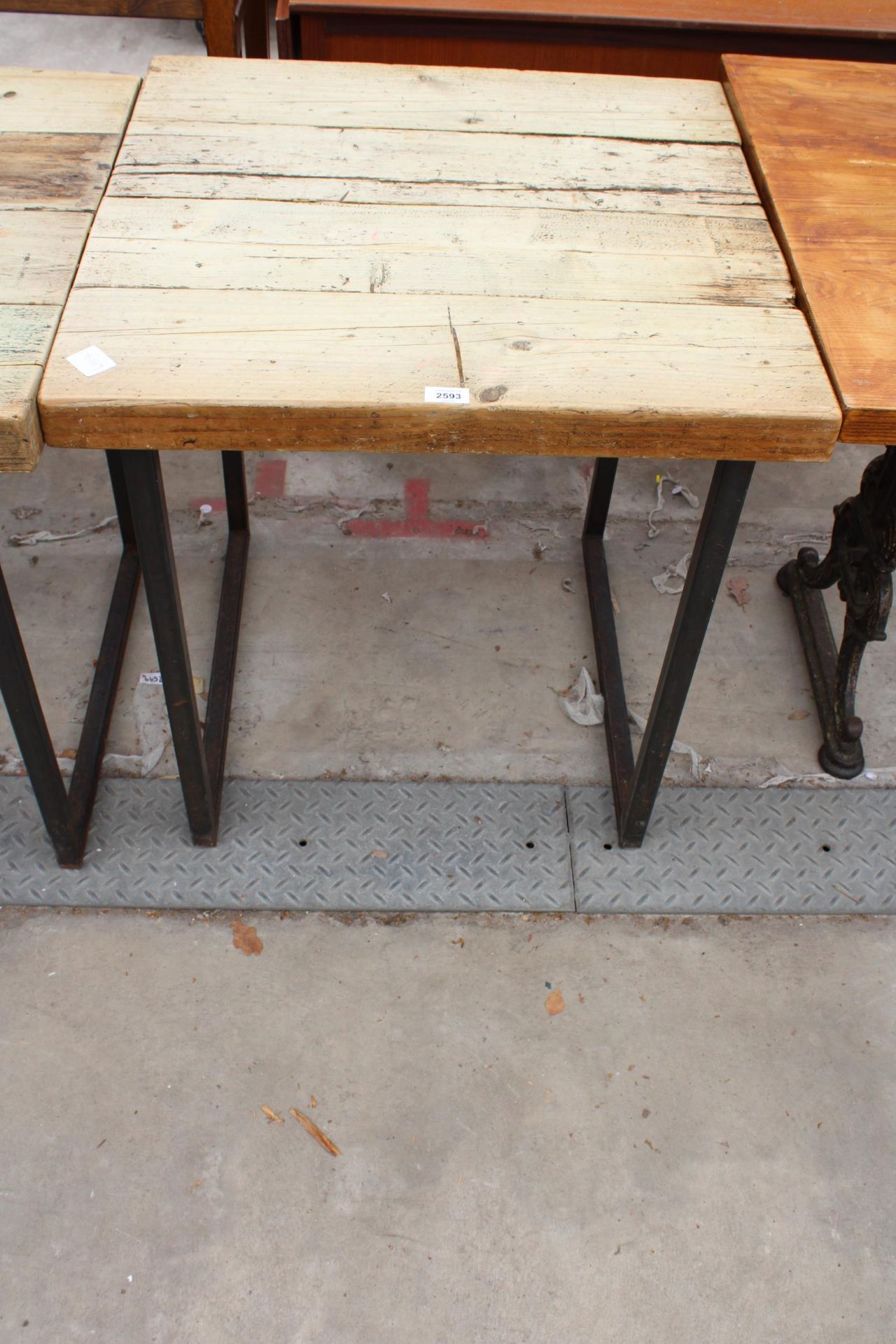 A RUSTIC FOUR PLANK TABLE, 27" SQUARE ON METAL LEGS