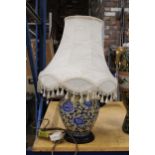A BLUE AND CREAM ORIENTAL STYLE LAMP WITH SHADE
