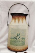 A METAL WALL HANGING CHURN, WITH THE IMAGE OF A ROOSTER ON A COW, 28CM X 53CM
