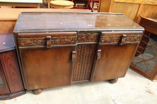 A MID 20TH CENTURY OAK SIDEBOARD, 54" WIDE