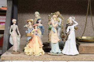 A COLLECTION OF TEN LADY FIGURINES