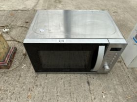 A SILVER KENWOOD MICROWAVE OVEN