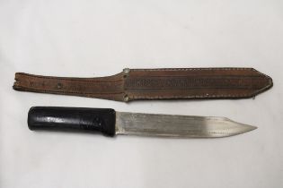 AN OLD KNIFE IN LEATHER SHEATH