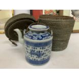 AN ANTIQUE BLUE AND WHITE CHINESE TEAPOT IN ORIGINAL BASKET