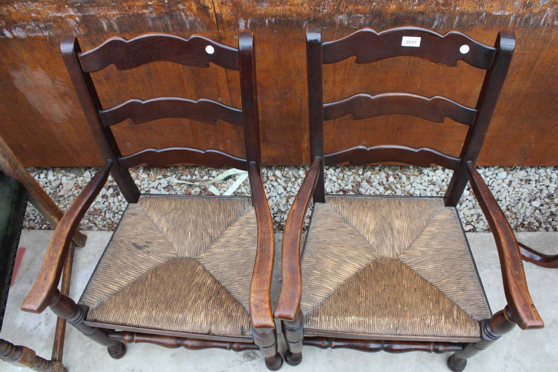 A PAIR OF 18TH CENTURY STYLE LOW OAK LADDER-BACK ELBOW CHAIRS WITH RUSH SEATS - Image 3 of 3