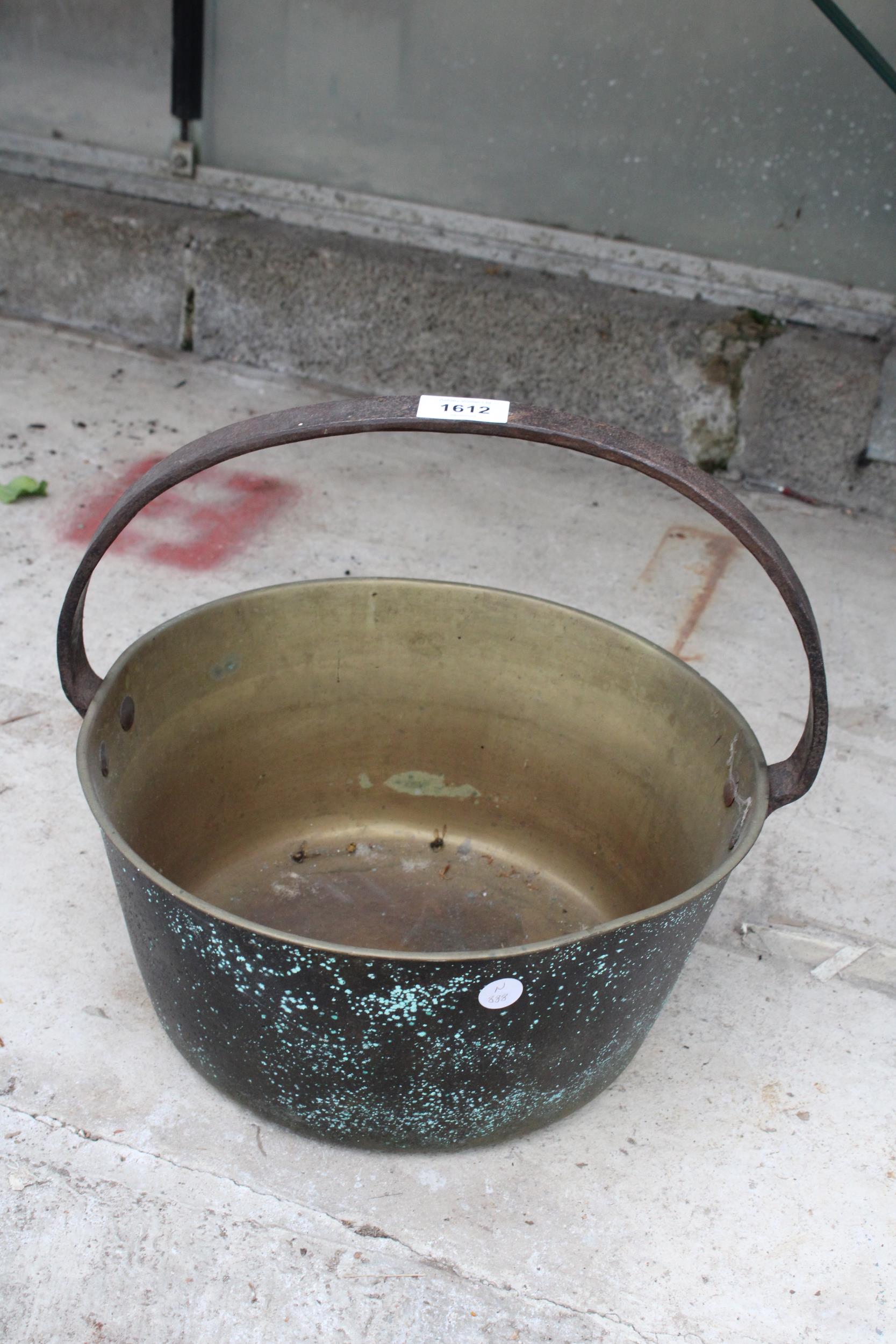 A VINTAGE BRASS JAM PAN WITH STEEL HANDLE