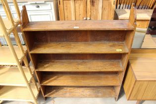 A MID 20TH CENTURY OAK FOUR TIER OPEN BOOKCASE, 37" WIDE