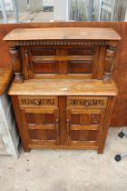 AN OAK JACOBEAN CORNER CUPBOARD