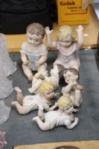 TWO LARGE AND FOUR SMALL ANTIQUE PORCELAIN BISQUE DOLLS
