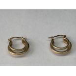 A PAIR OF 9 CARAT GOLD HOOP EARRINGS IN A THREE HOOP DESIGN