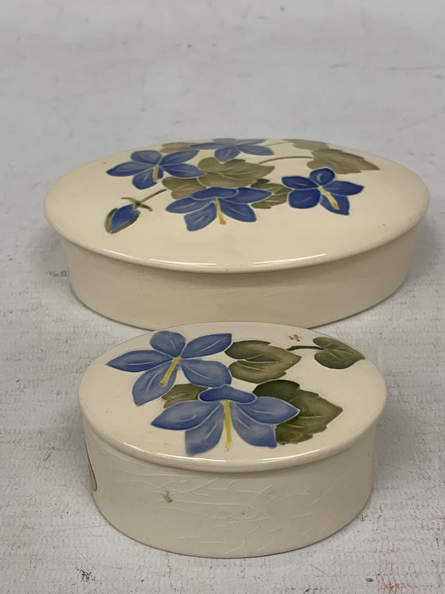 TWO SMALL UNMARKED MOORCROFT CAMPANULA OVAL TRINKET BOXES