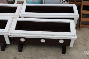 A PAIR OF WOODEN PAINTED GARDEN TROUGH PLANTERS
