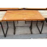 A WOODEN PUB TABLE ON CAST IRON BASE, 47" X 28"
