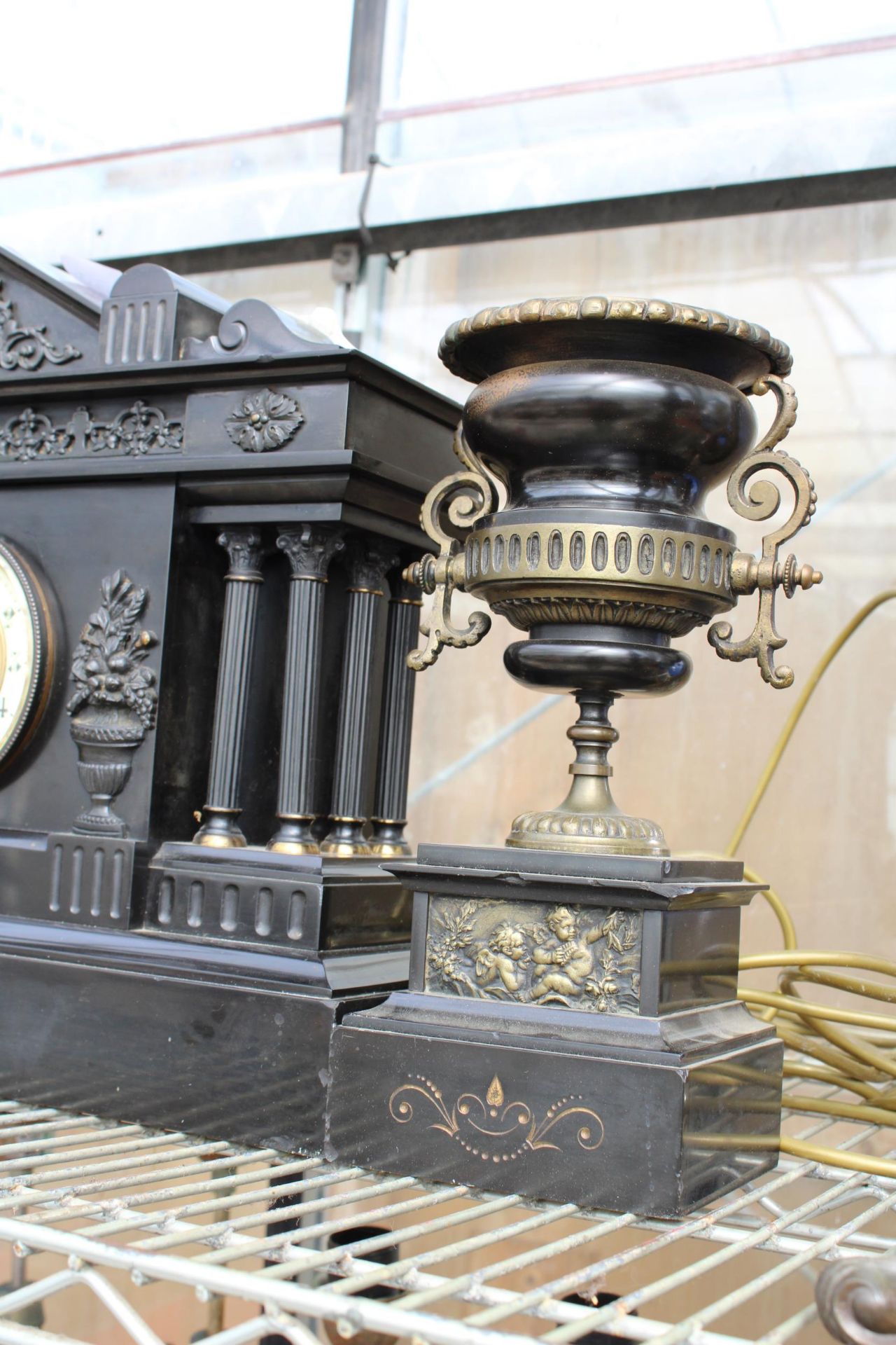 A HEAVY SLATE MANTLE CLOCK WITH A PAIR OF MATCHING CANDLE HOLDERS WITH PLAQUE INSCRIBED 'PRESENTED - Image 2 of 4