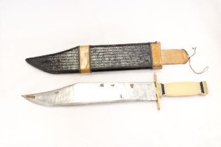 A BOWIE KNIFE IN SHEATH - APPROXIMATELY 40CM LONG