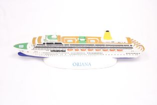 A HEAVY, SOLID, OCEAN LINER ON A STAND, 'ORIANA', LENGTH 30CM, HEIGHT 6CM