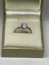 A GOLD ON SILVER SOLITAIRE RING