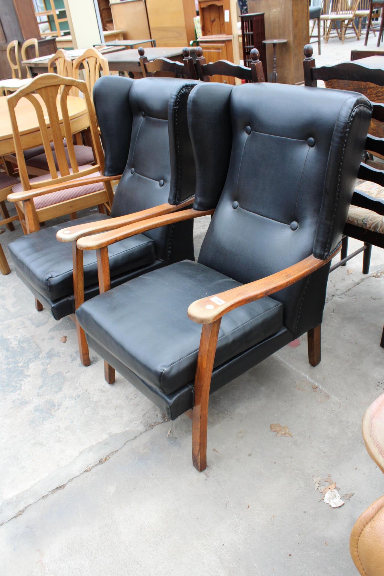 A PAIR OF MID 20TH CENTURY WINGED FIRESIDE CHAIRS - Image 2 of 2