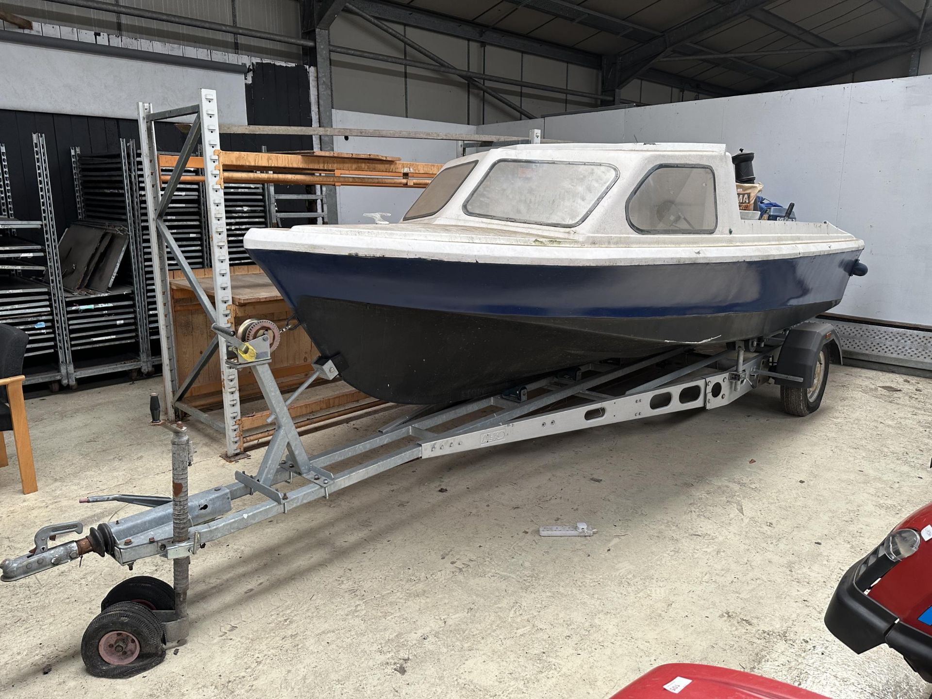 A SHETLAND 535 (MODIFIED)FISHING BOAT WITH EVINRUDE 35 OUTBOARD MOTOR & MERCONTROL WITH A NEW