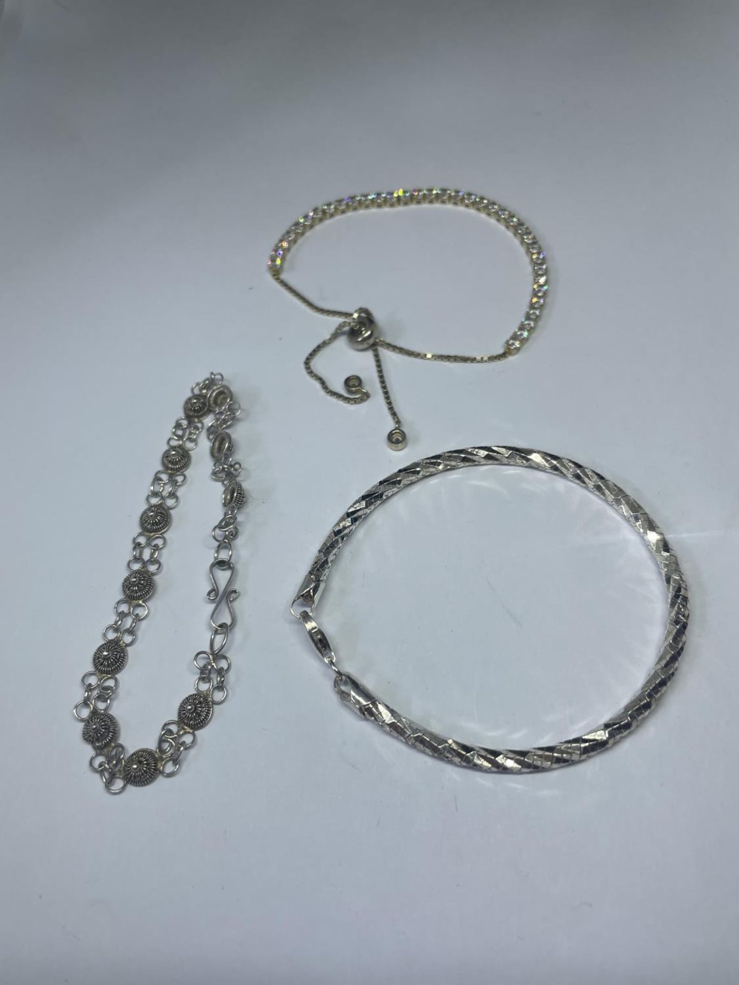 THREE SILVER BRACELETS