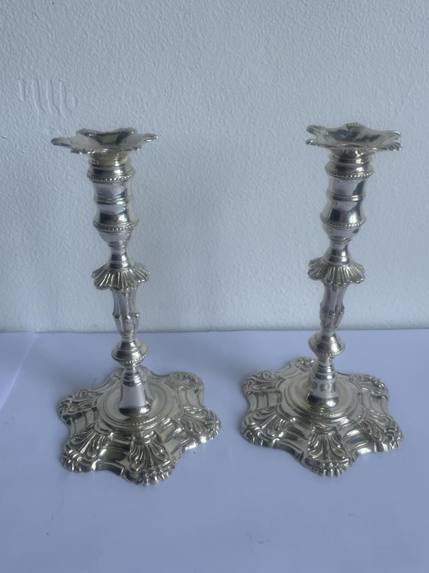 A PAIR OF DECORATIVE HALLMARKED BIRMINGHAM SILVER CANDLESTICKS GROSS WEIGHT 450 GRAMS