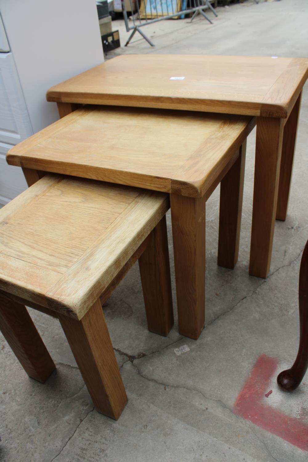 A MODERN OAK NEST OF THREE TABLES - Image 3 of 3
