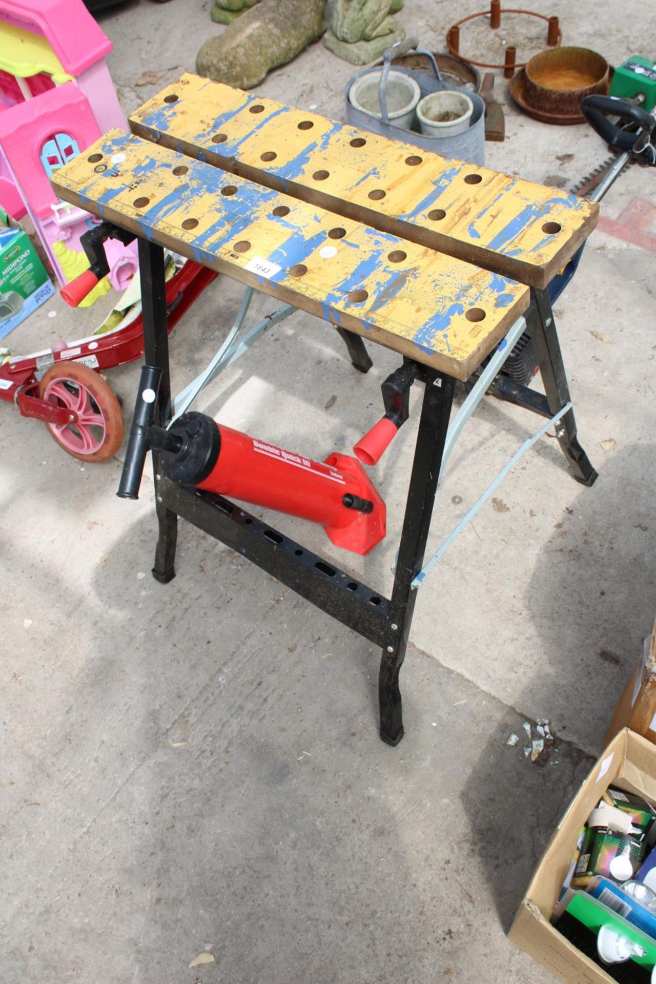 A FOLDING WORKMATE BENCH AND A PUMP