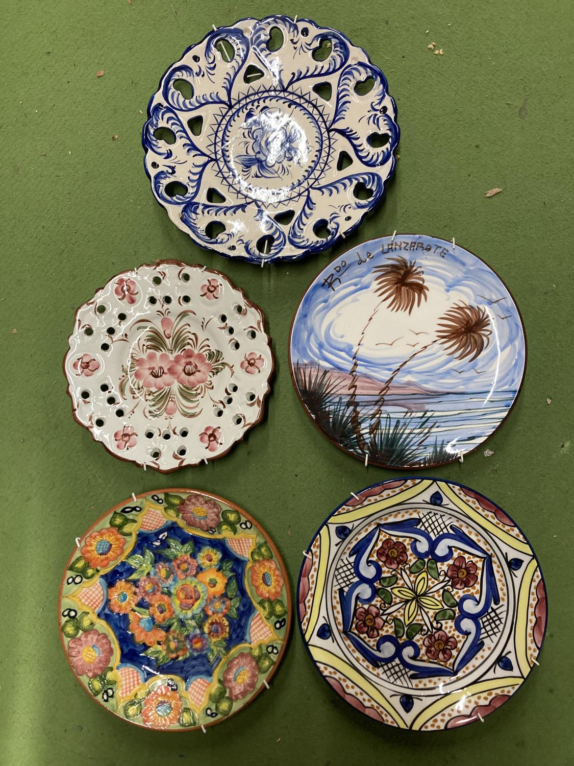 A QUANTITY OF BRIGHTLY COLOURED, CONTINENTAL, STUDIO POTTERY PLATES