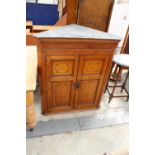 A GEORGE III OAK AND INLAID TWO DOOR CORNER CUPBOARD, 37" WIDE