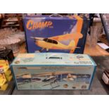 A BOXED SABRE READY TO FLY R/C HELICOPTER AND A HOBBYZONE R/C AREOPLANE, BOTH CONTROLLERS PRESENT