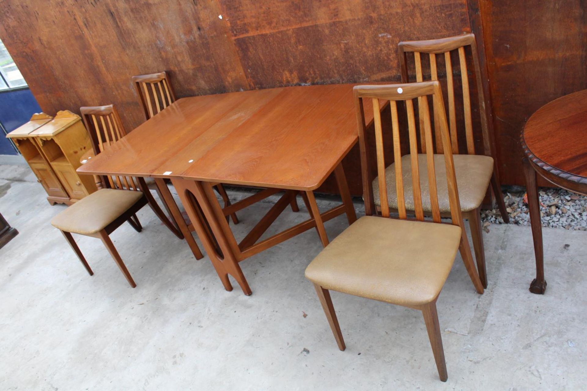 A RETRO TEAK DROP-LEAF DINING TABLE, 57" X 33" OPENED AND FOUR DINING CHAIRS