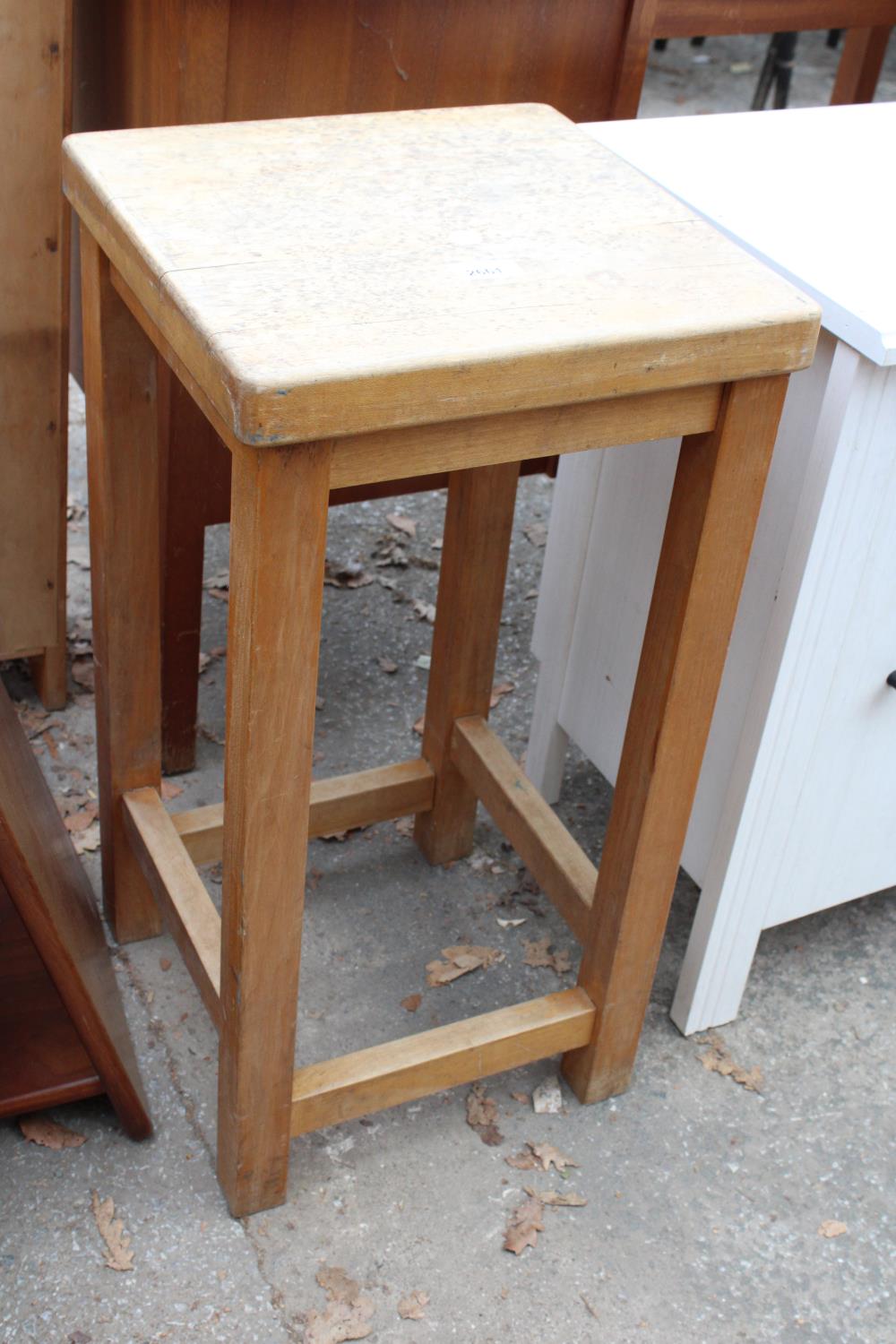 A TALL BEECH FRAMED STOOL