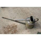 A LONG SPOUTED GALVANISED WATERING CAN